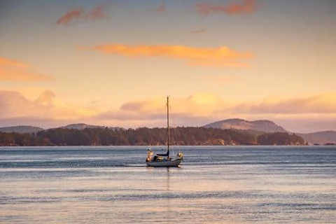 Sailing boat at sea at sunset, British Columbia, Canada Stock Photos