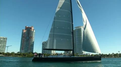Sailing boat slowly navigating close to the coast in Miami  Stock Footage 43318228