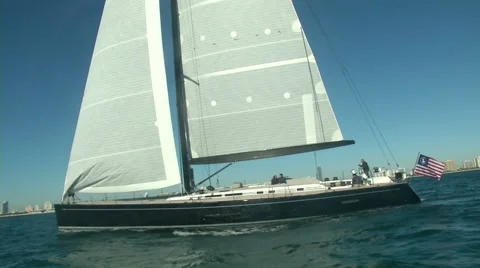 Sailing boat slowly navigating close to the coast in Miami  Stock Footage 43318483