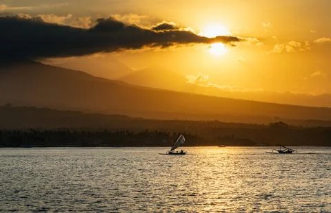 Sailing boat at sunset Stock Photos