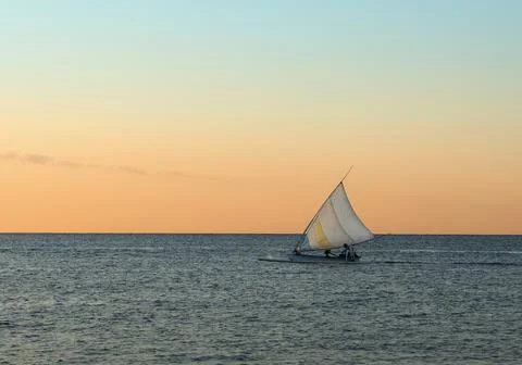 Sailing boat at sunset Stock Photos