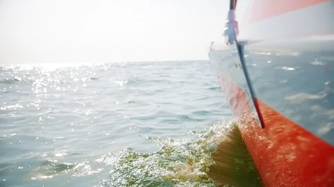 Sailing boat through the waves Видео 79026296