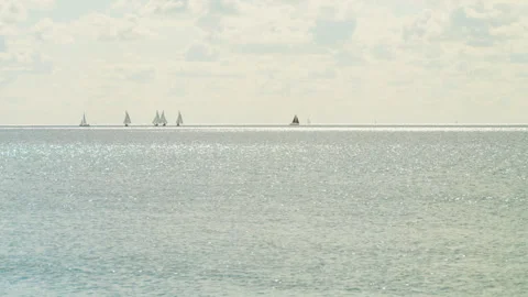 Sailing boats on the distant horizon Stock Footage 240639464