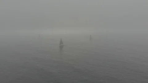 Sailing boats in the mist Stock Footage 108070068