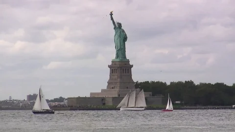 Sailing boats pass in front of the Statue of Liberty - circa 2009 HD Stock Footage 95200639