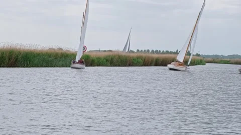 Sailing boats on the RIver Bure during a sailing regatta Video stock 309955995
