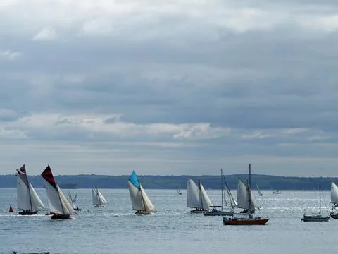 Sailing boats with stunning cloudscape, Cornwall, UK Stock Photos