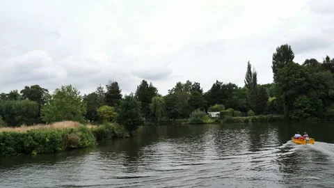 Sailing on bright yellow self-drive motor boat on river thames Stock Footage 137649350