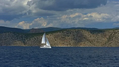 Sailing catamaran on the background of the island. Stock Footage 103577478