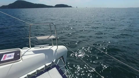 Sailing catamaran floats on the waves Stock Footage 164918924