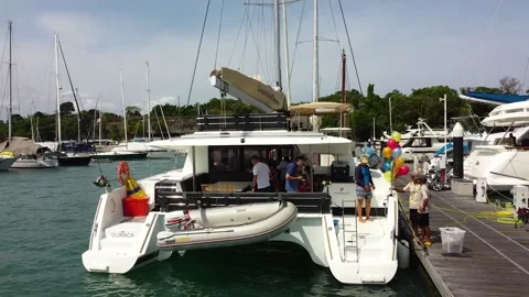Sailing catamaran passengers are preparing for departure Stock Footage 186926883
