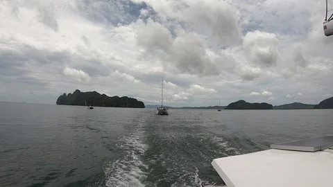 Sailing catamarans go one after another on a sea voyage in Phang Nga province 库存影片 167850524