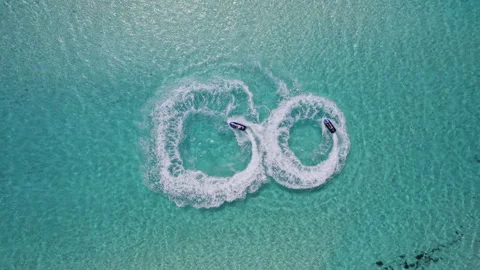 Sailing in circles on a jet ski on the sea Stock Footage 243296773