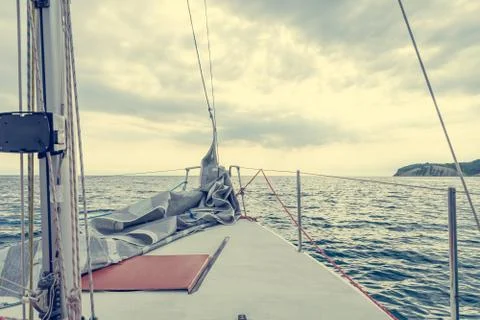 Sailing in cloudy weather - view from the deck. Stock Photos