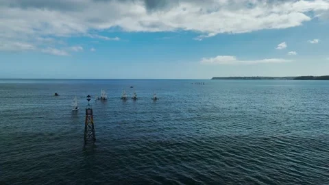 Sailing Club training at cloudy sky from a drone, Paignton, Devon, UK Stock Footage 236330239