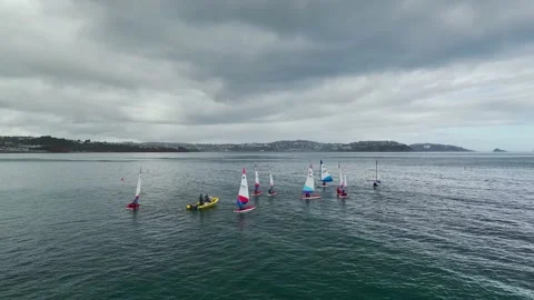 Sailing Club training at cloudy sky from a drone, Paignton, Devon, UK Stock Footage 236331022