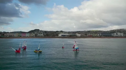 Sailing Club training at cloudy sky from a drone, Paignton, Devon, UK Stock Footage 236433416
