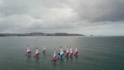 Sailing Club training at cloudy sky from a drone, Paignton, Devon, UK Stock Footage 236433580