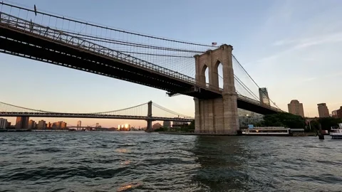 Sailing on East River Under the Manhattan and Brooklyn Bridge Timelapse Stock Footage 219161841