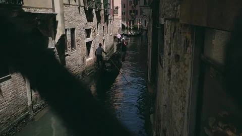 Sailing gondolas view through the metal bridge fence in Venice Video stock 79060965