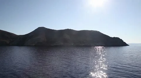 Sailing by island Stock Footage 8847845