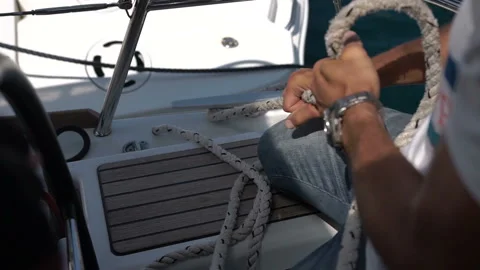 Sailing man winding sails rope Stock Footage 101737117