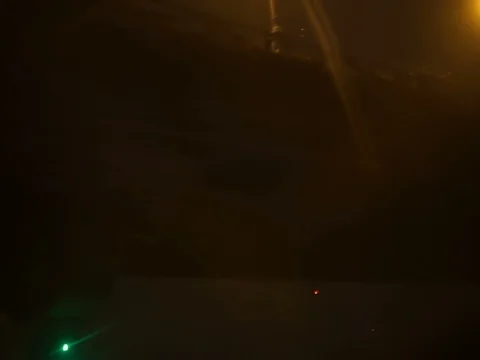 Sailing at night under the bridge with yellow lights Stock Footage 71865090
