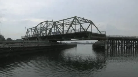 Sailing by Open Swing Bridge Stock Footage 11249714