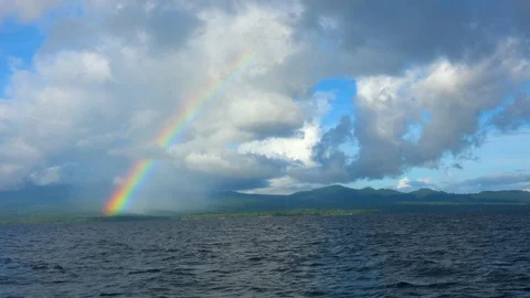 Sailing in the Pacific Ocean toward rainbow. Stock Footage 108039728