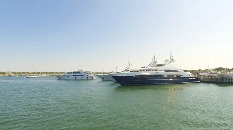 SAILING PASS YACHTS IN WATER Stock Footage 104290650