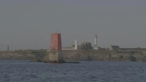 Sailing past Pointe Saint-Mathieu lighthouse and sea marker in Brittany Stock Footage 330675612