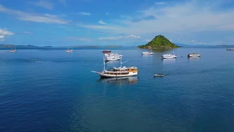 Sailing phinisi boats, pristine tropical paradise. Unique aerial view drone Stock Footage 335156718