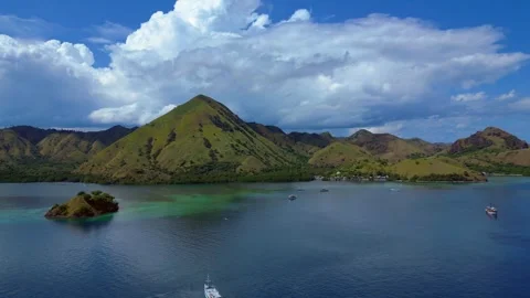 Sailing phinisi boats, pristine tropical paradise. Smooth aerial view drone Stock Footage 344602917