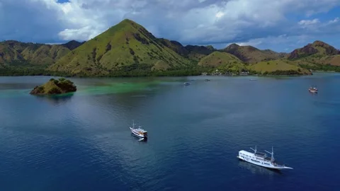Sailing phinisi boats, pristine tropical paradise. Great aerial view drone Stock-Footage 344603219