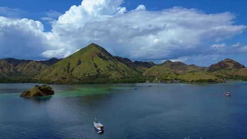 Sailing phinisi boats, pristine tropical paradise. Magic aerial view drone Stock-Footage 344612411
