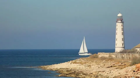 Sailing race on the background of the lighthouse Stock Footage 42762205