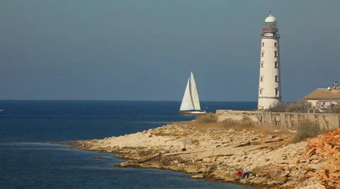Sailing race on the background of the lighthouse Stock Footage 42762679
