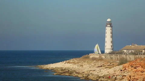 Sailing race on the background of the lighthouse Stock Footage 42762820