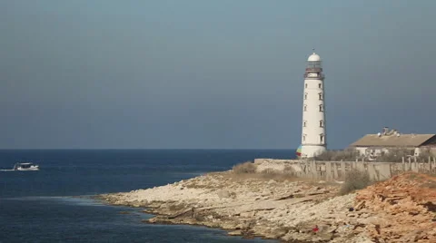 Sailing race on the background of the lighthouse Stock Footage 42763164