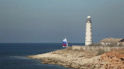 Sailing race on the background of the lighthouse Stock Footage 42763306