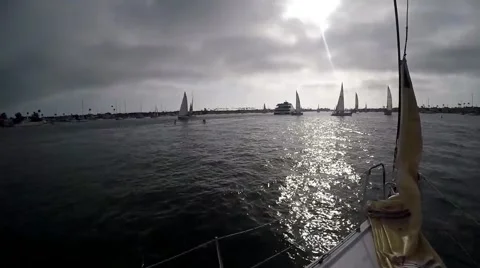 Sailing into the race start with jib down other racers under sail dodge each Video stock 67508096