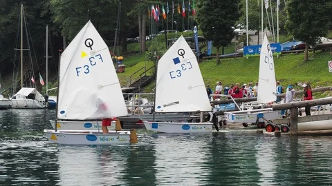 Sailing school on small boats. School on Lake Ledro. Alpine lake. Summer time Stock Footage 121605965