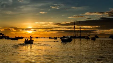 Sailing to the setting sun Stock Photos