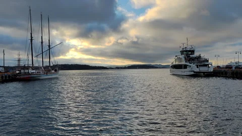 Sailing ship and ferry moored at the port in Oslo, Norway Stock Footage 336913196