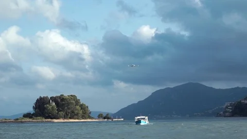 Sailing ship and flying plane, Mouse Island (Pontikonisi), Corfu Island, Greece Video stock 114019200