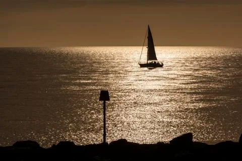 Sailing Ship and Sunset Stock Photos