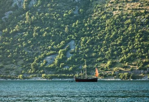 Sailing ship on the background of mountains Stock Photos