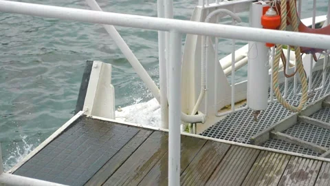 Sailing ship breaks waves in slow motion 180fps Stock Footage 156486247