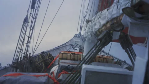 Sailing ship cutting through rough ocean waves Stock Footage 337951669