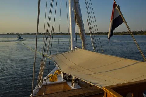 Sailing ship "Dahabeya" pulled by a motor boat on Nile, Egypt, Africa Stock Photos